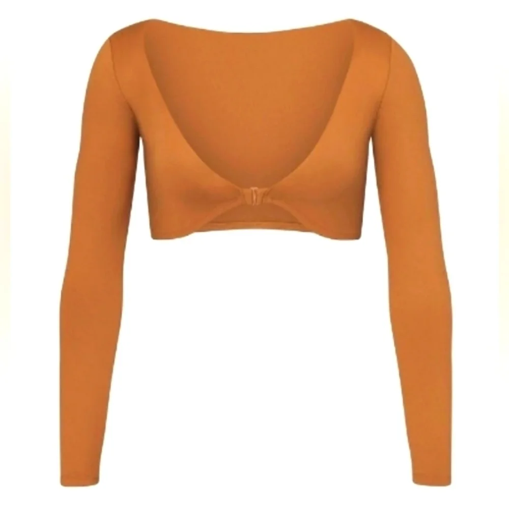 Skims long sleeve shrug.